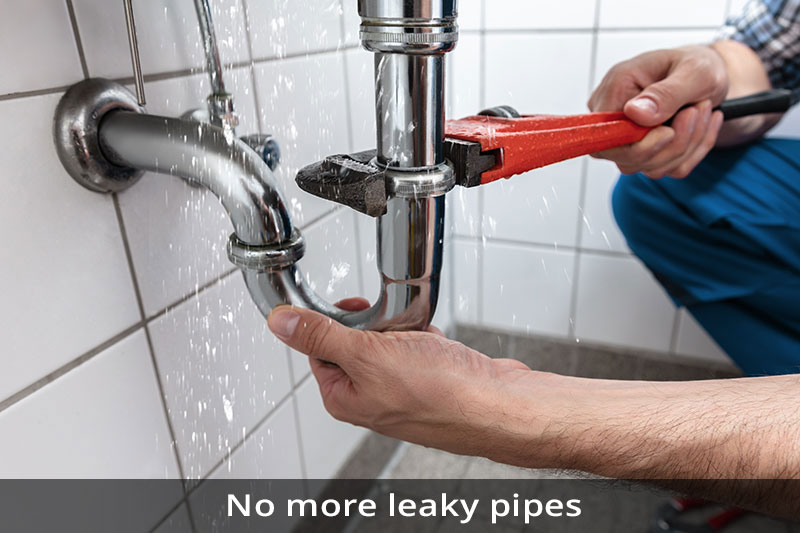 A person is fixing pipes with a pair of pliers.